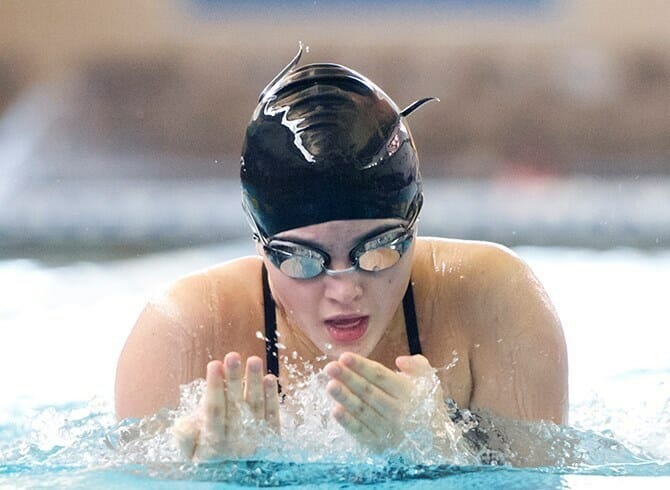 WOMEN BEAT QUEENS COLLEGE IN A EVENLY MATCHED MEET