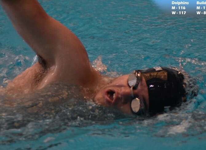 DOLPHINS SWIM PAST BULLDOGS TO CRUCIAL CUNYAC WIN
